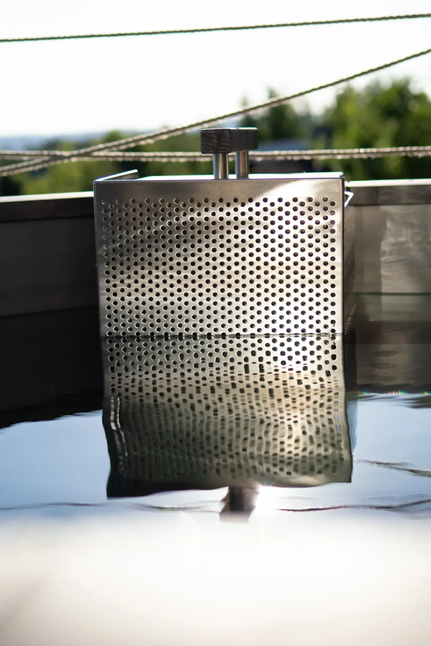 Close-up of the stainless-steel heater submerged in the hot tub.