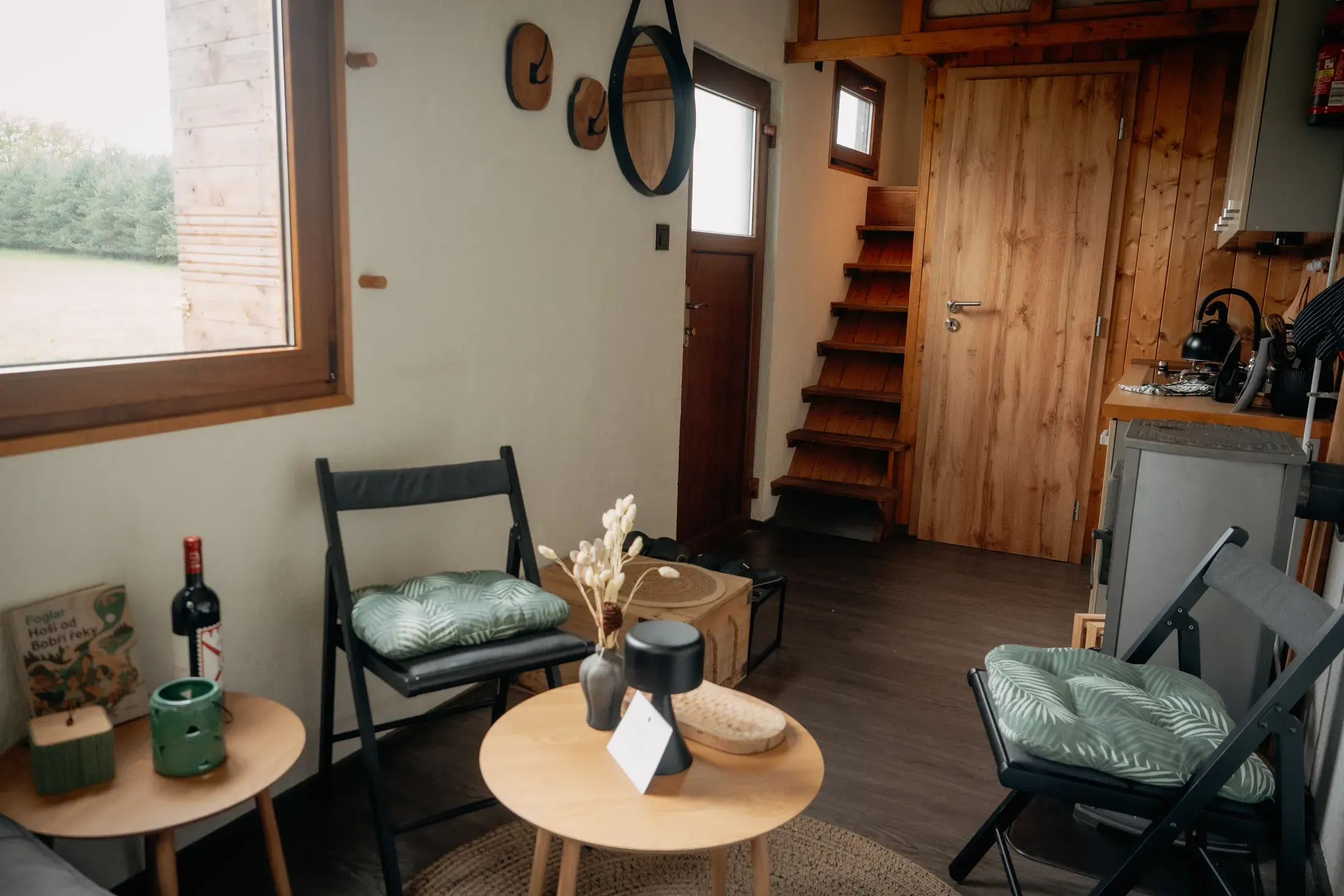 The living nook seen from above: sofa, rug and coffee table.