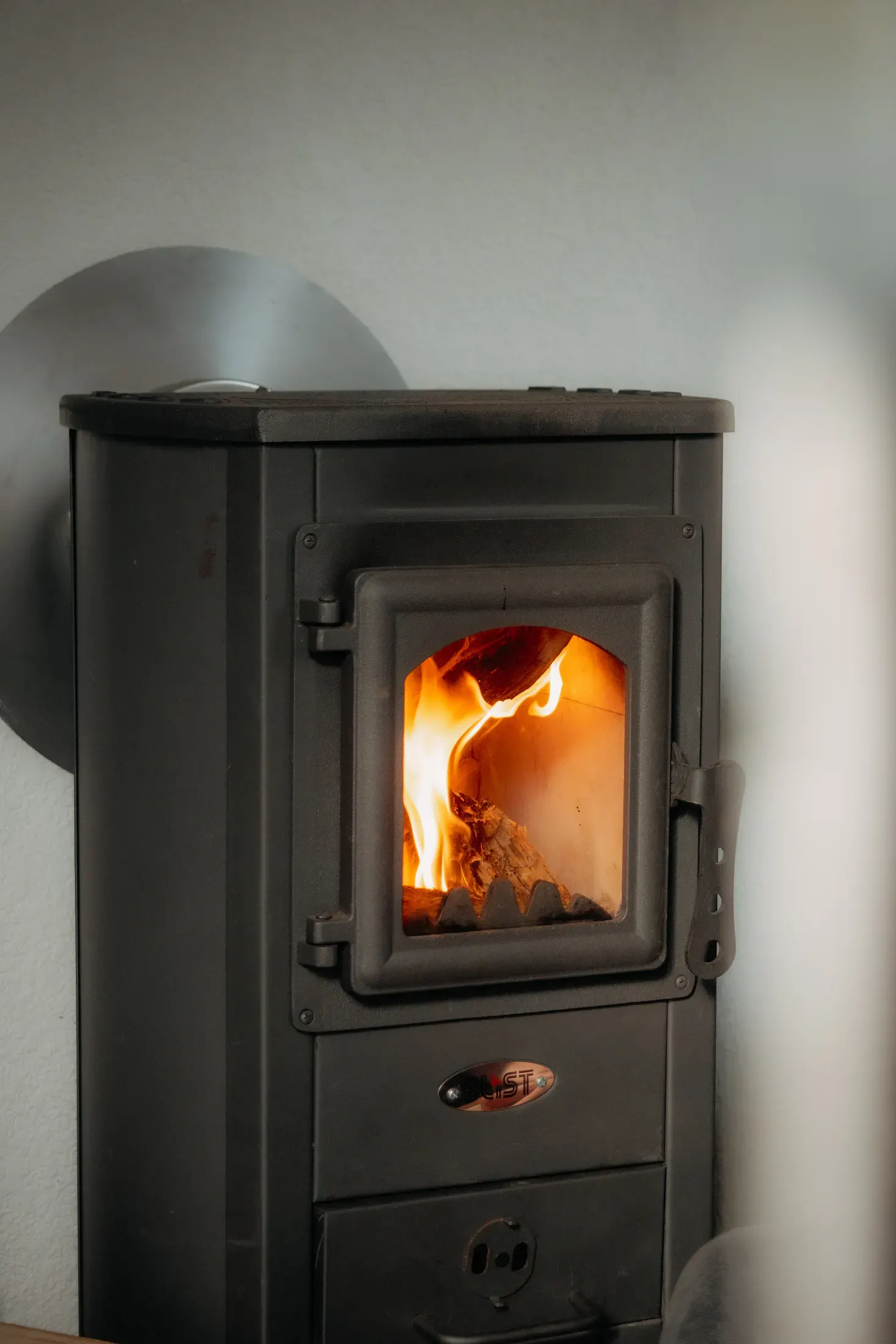 A cast-iron wood stove in the living nook.